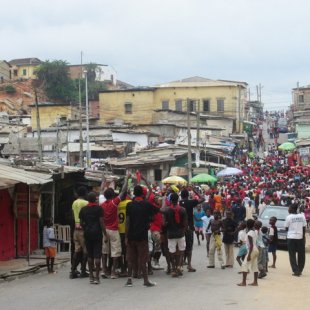 The celebration of a funeral parading in the streets