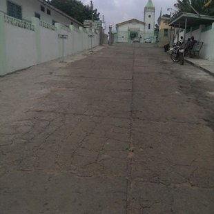 The walkway to the gate entrance with the school chapel at the top of the hill
