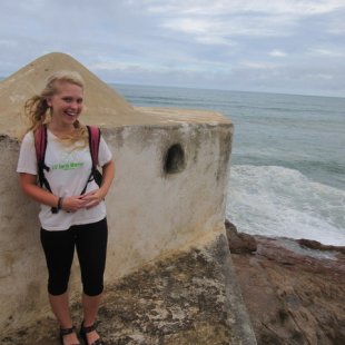 Charli sanding on a peer at the castle