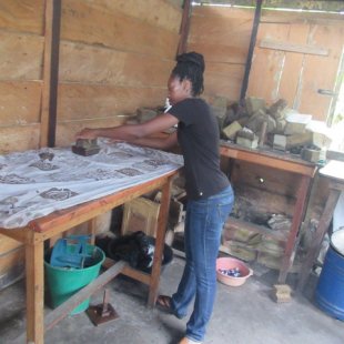 Theatrice making her design with a wax stamp