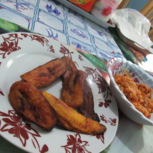 Fried plantains I heloed cook, with tomato fish stew