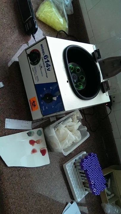 The centrifuge we use along side a broken tile peice used for Typhoid screening and blood 