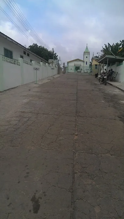The walkway to the gate entrance with the school chapel at the top of the hill