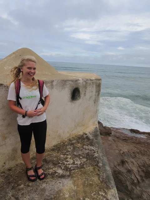 Charli sanding on a peer at the castle